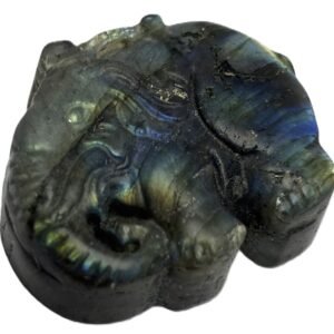 Polished natural labradorite freeform slab with blue and golden schiller sians emporium Natural polished labradorite stone slice showing golden bronze and cobalt blue schiller with dark rough natural edges against a white background