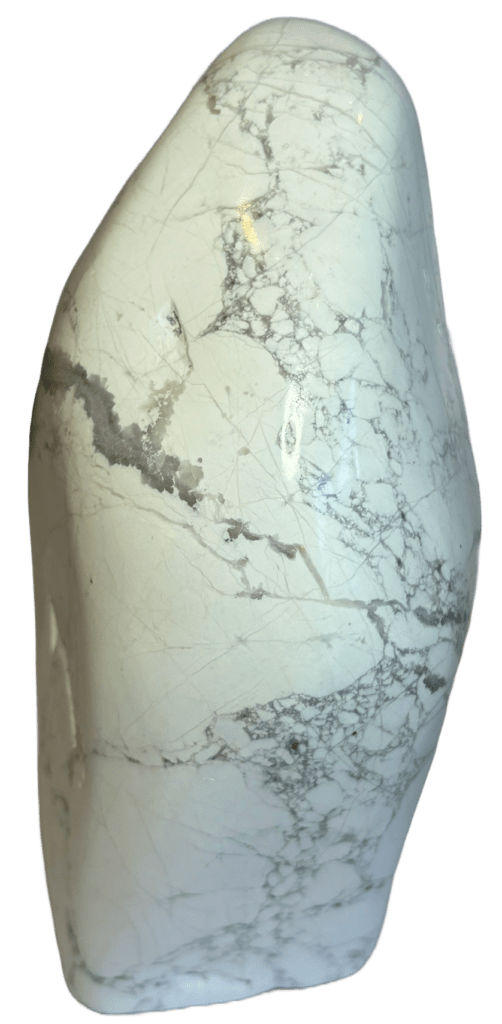 Polished natural white howlite freeform standing stone showing distinct grey spiderweb veining across a porcelain finish