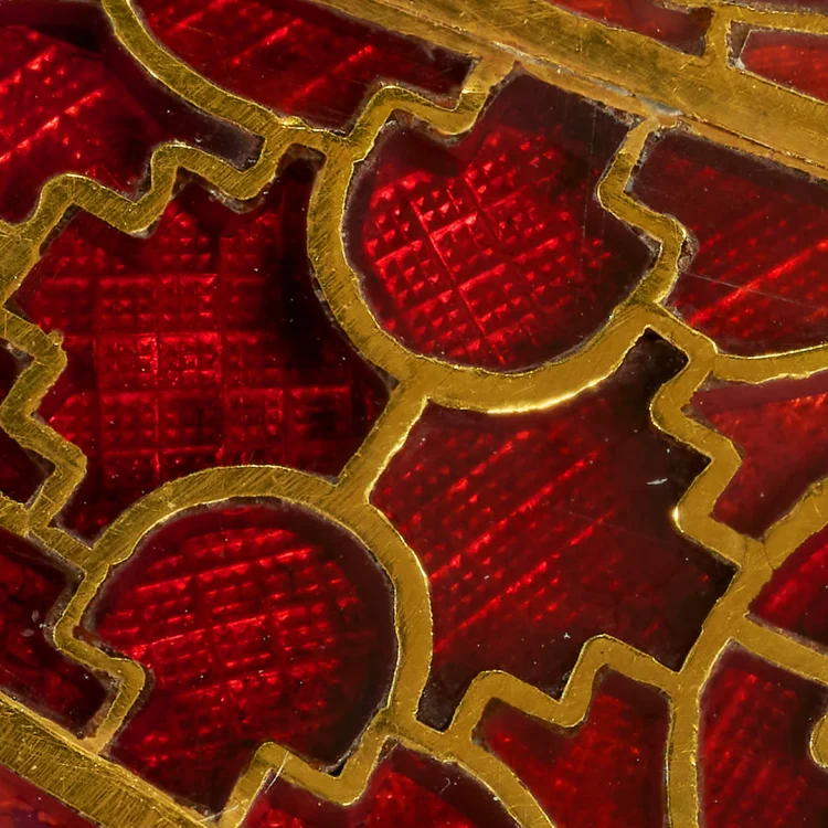 Close up of red garnet cloisonné inlay set within gold cells in early medieval jewellery