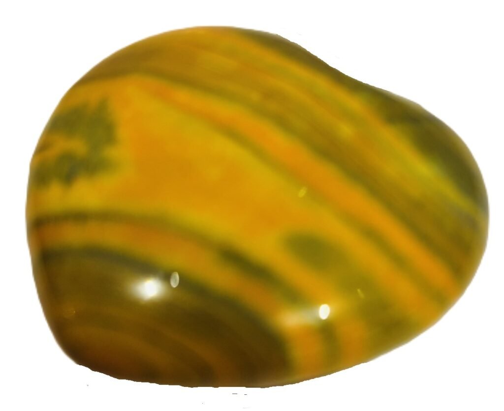 Polished heart shaped bumblebee jasper stone displaying vibrant yellow orange and dark grey volcanic banding on a white background